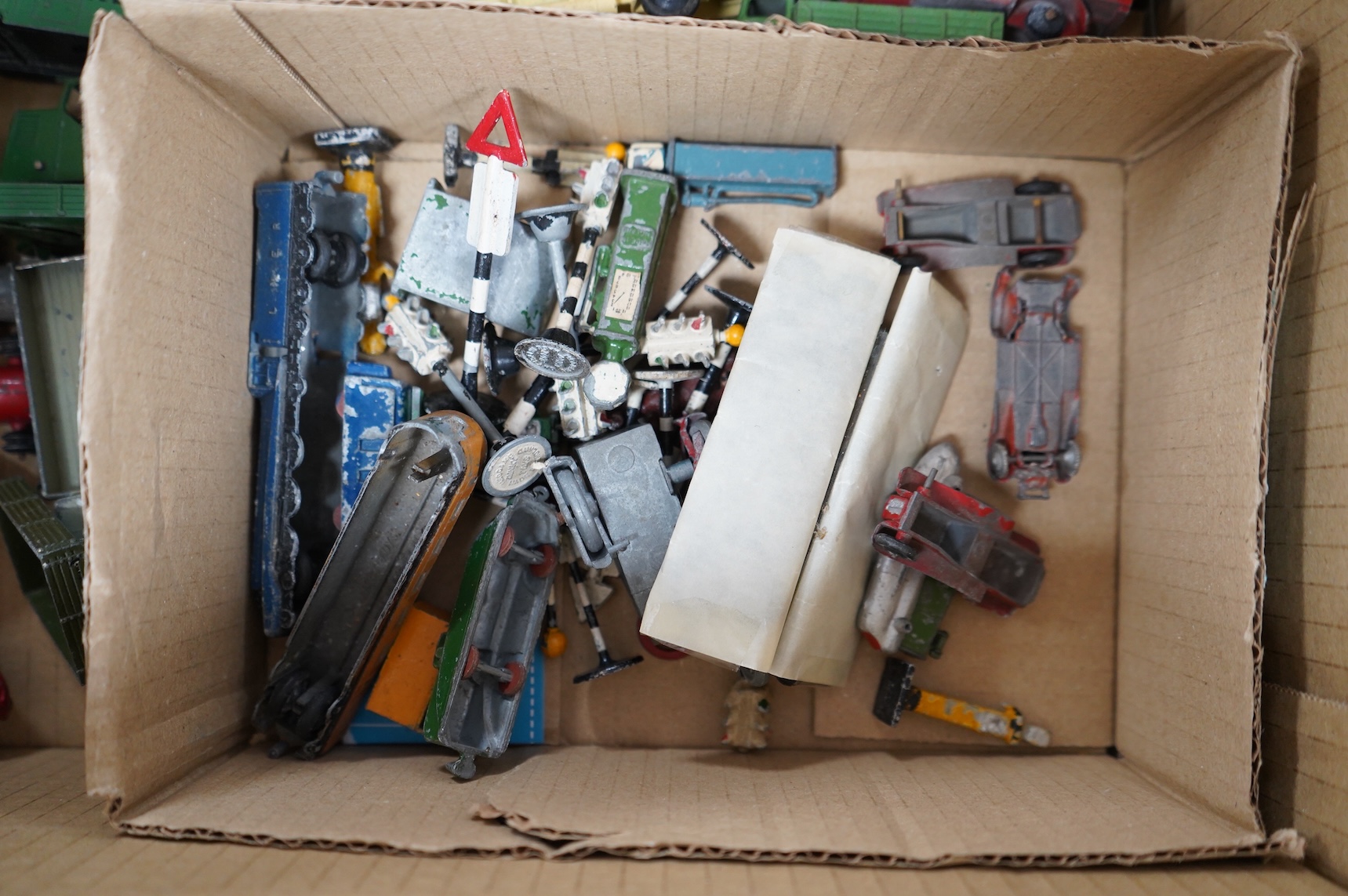 Forty-four 1950s/60s Dinky Toys, etc. including thirty-two commercial vehicles, public transport vehicles, etc. including; market gardener’s wagons, petrol wagons, double deck buses, a Bedford tipper, racing cars, a mech